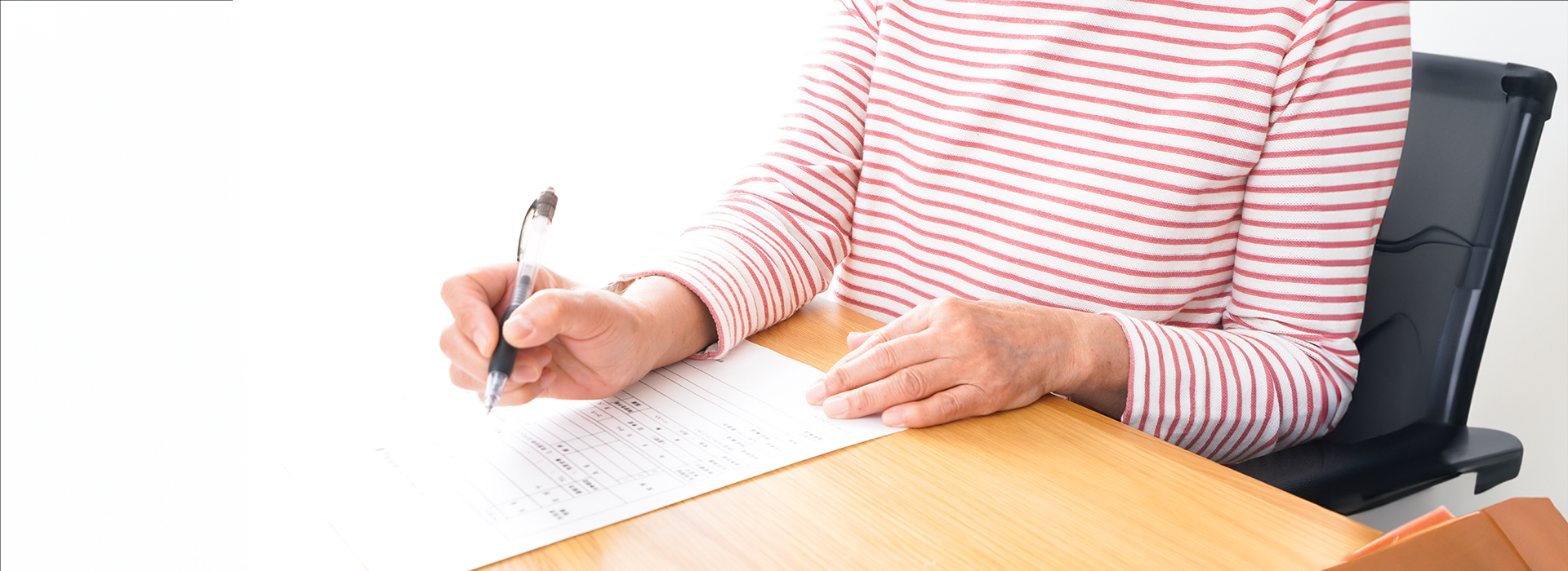 woman filling out application paperwork