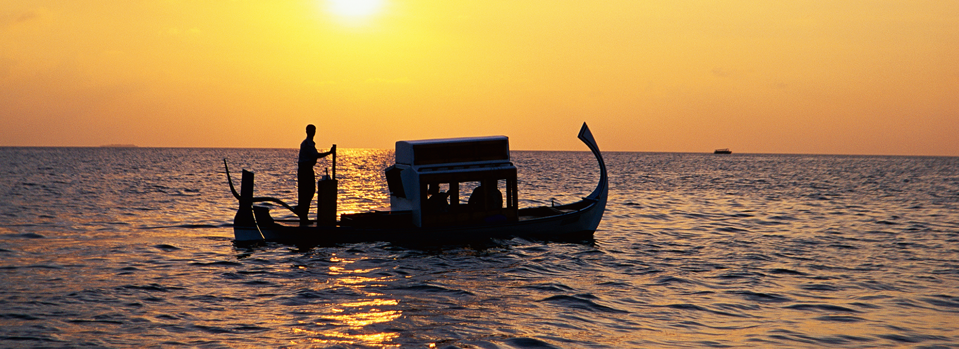 Boat in the Maldives at sunset